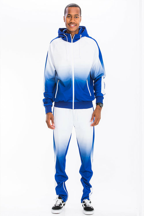 Person wearing a blue and white gradient tracksuit on a white background