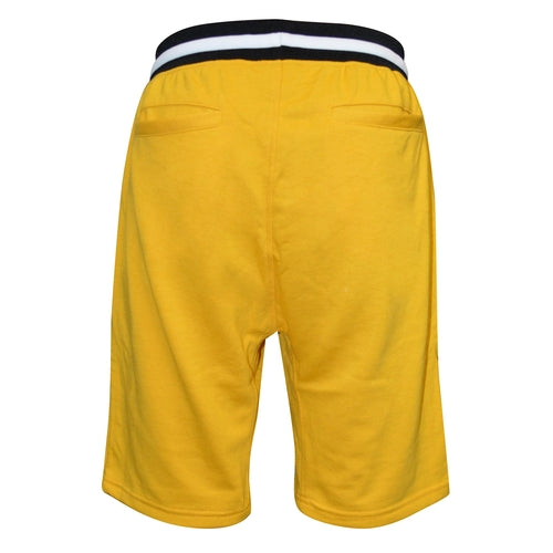 Yellow shorts with a black and white waistband on a white background