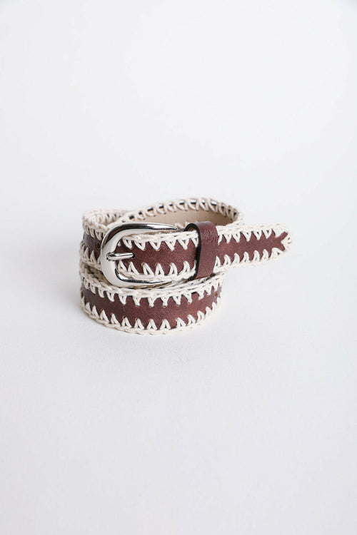 Brown belt with white pattern and silver buckle on a white background