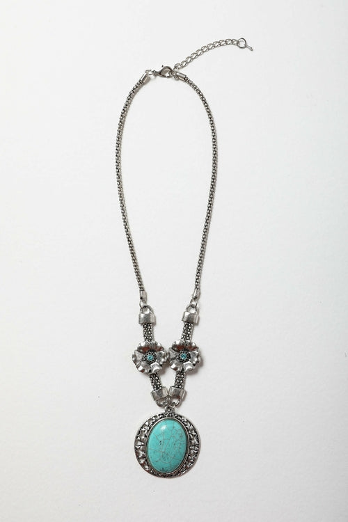 Necklace with turquoise pendant on a white background
