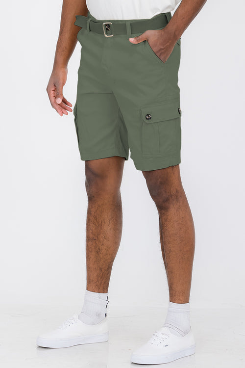 Person wearing green cargo shorts on a white background