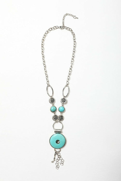 Necklace with turquoise beads and silver chain on a white background