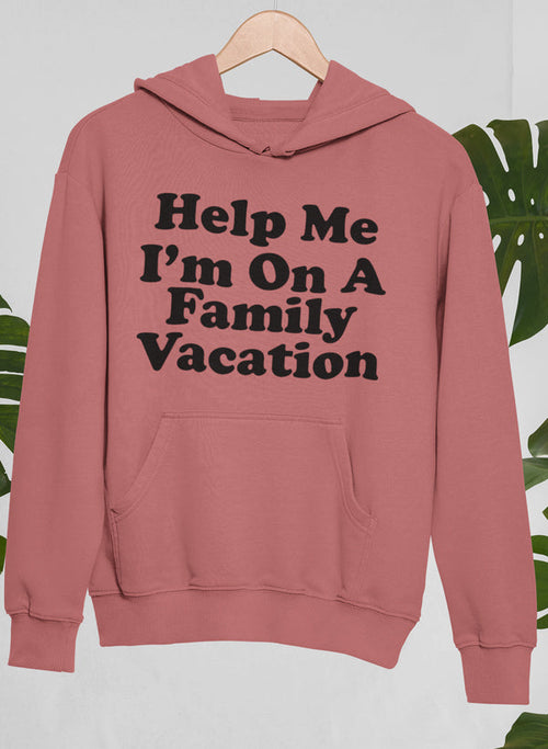 Pink hoodie with 'Help Me I'm On A Family Vacation' text on a light gray background
