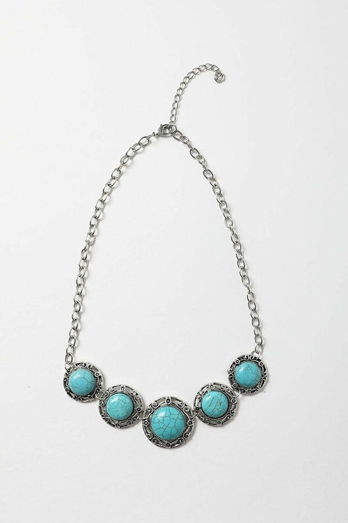 Necklace with turquoise stones on a white background