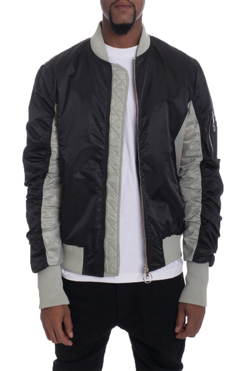 Black and gray jacket with white shirt and black pants on a white background