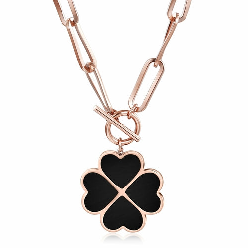 Rose gold necklace with a black clover-shaped pendant on a white background