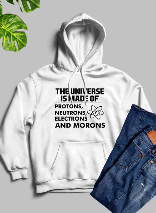 White hoodie with humorous text design on a gray background with jeans and a plant.
