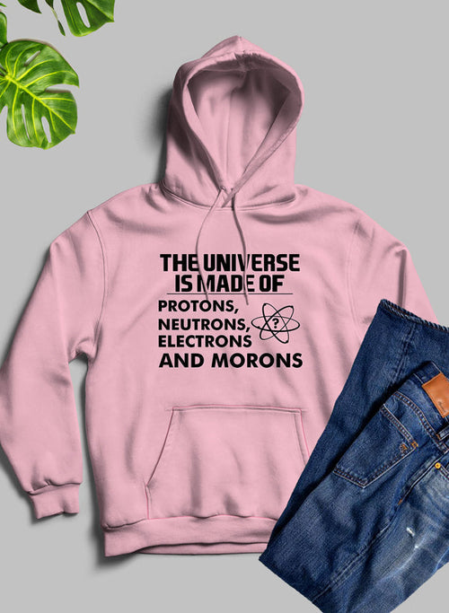 Pink hoodie with text and jeans on a gray background