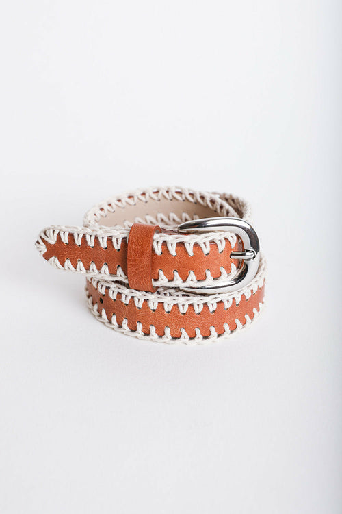 Brown leather belt with white stitching on a light gray background