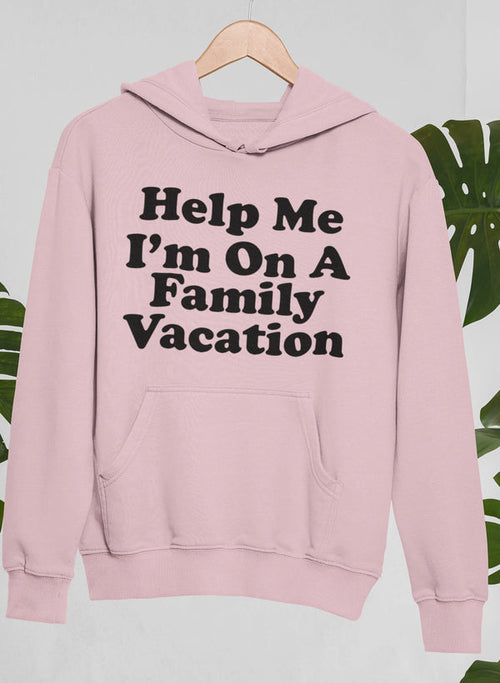 Pink hoodie with text 'Help Me I'm On A Family Vacation' on a light pink background